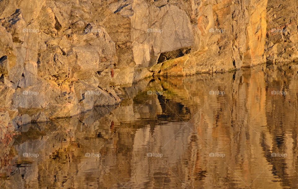 Reflection of rock in water