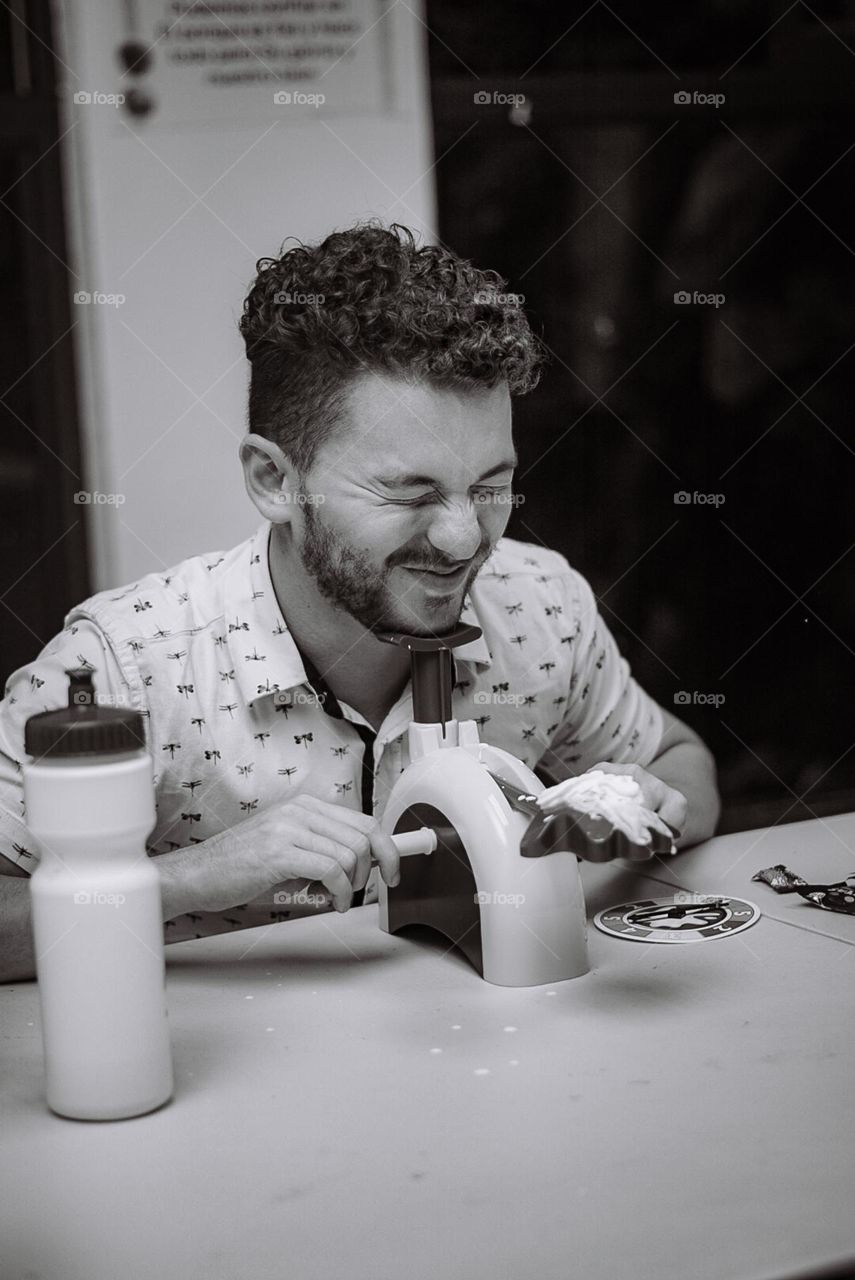 Young man with a disgusted face when playing a board game