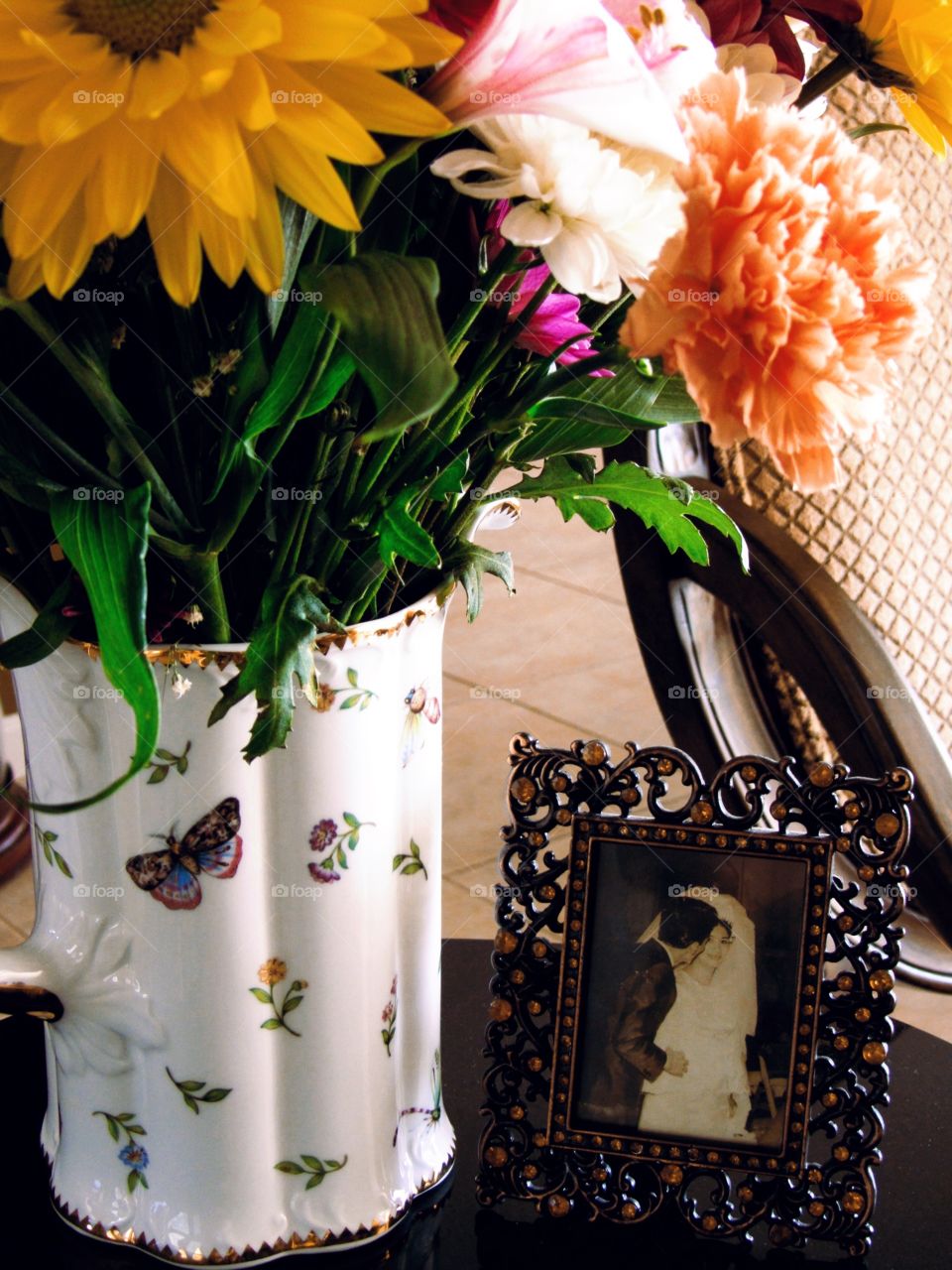 Wedding frame near the flower vase