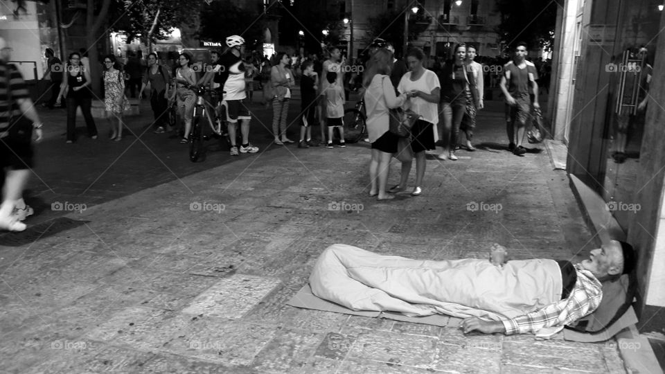 sleeping on jerusalen streets. old man resting on floor in jerusalen