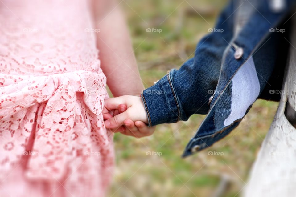 Twins Holding Hands