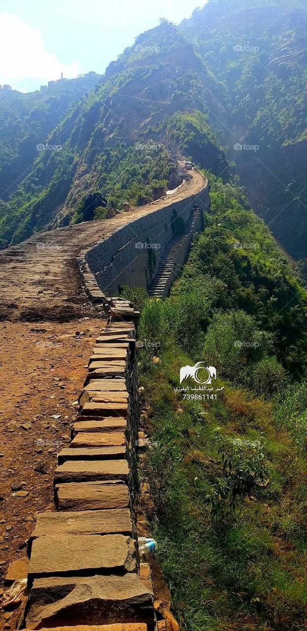 A stunning view of green mountains covered in fog in Yemen
