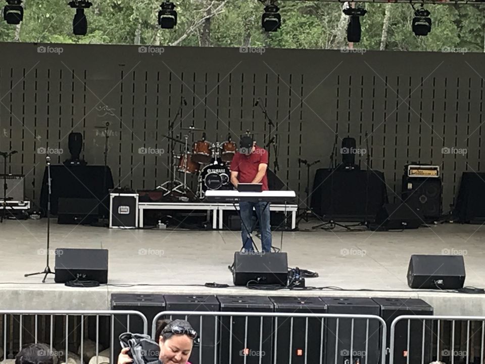 A keyboardist plays at Bower Ponds for Canada Day.