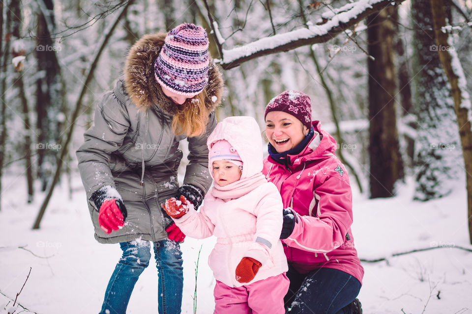 Mother spending time with her children outdoors in the wintertime