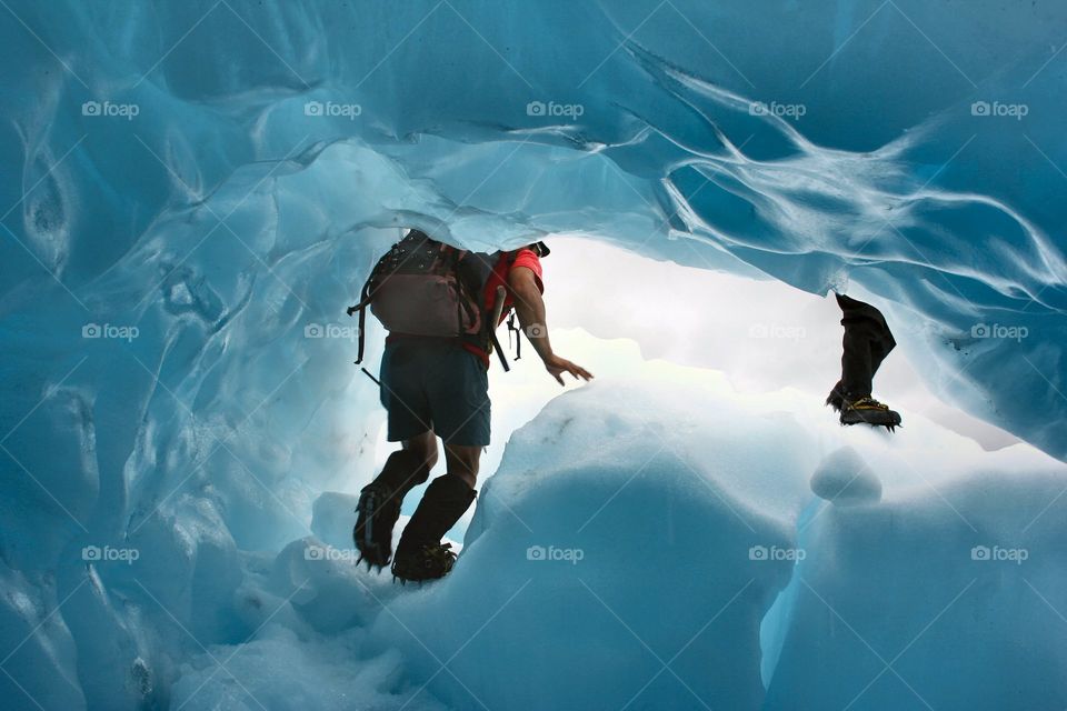 Human walking in snowy cave