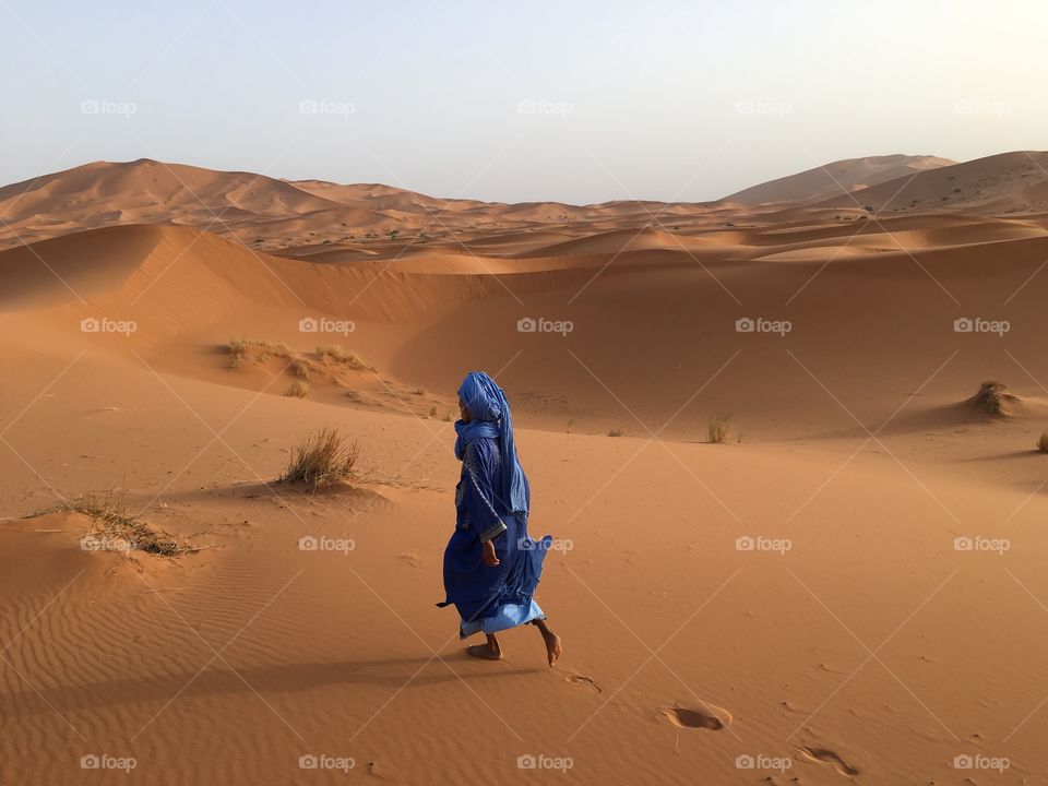 A Morocco Berber local leading the way in the Sahara Desert