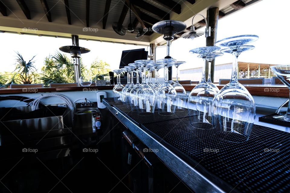 Bar table and wine glass inside the restaurant with no people