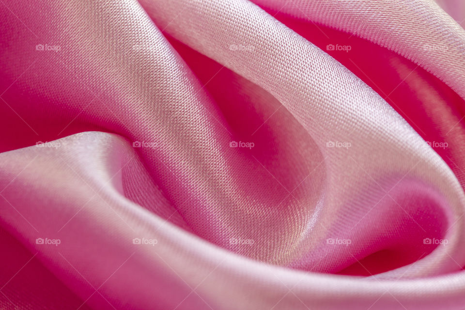 Satin Luxury Cloth Texture Can Use As Abstract Holidays. Abstract design background. Smooth Elegant Shiny Pink Silk