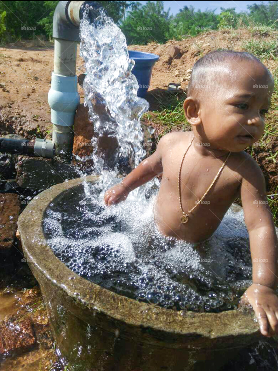 child taking bath in early morning.