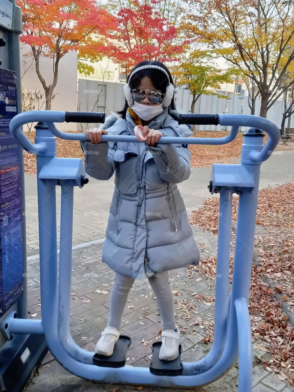 its cold but nothing can stop her from going outside. with the help of her winter clothes, everything is possible. she walked around and do some exercise.