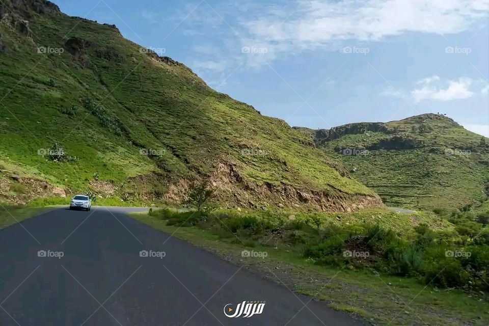 Glory be to God, the magnificent and picturesque view and the natural green trees are a view that is nothing more wonderful than it