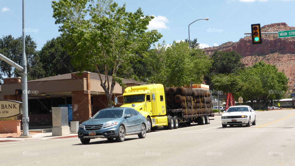 Vehicles and a truck on the road