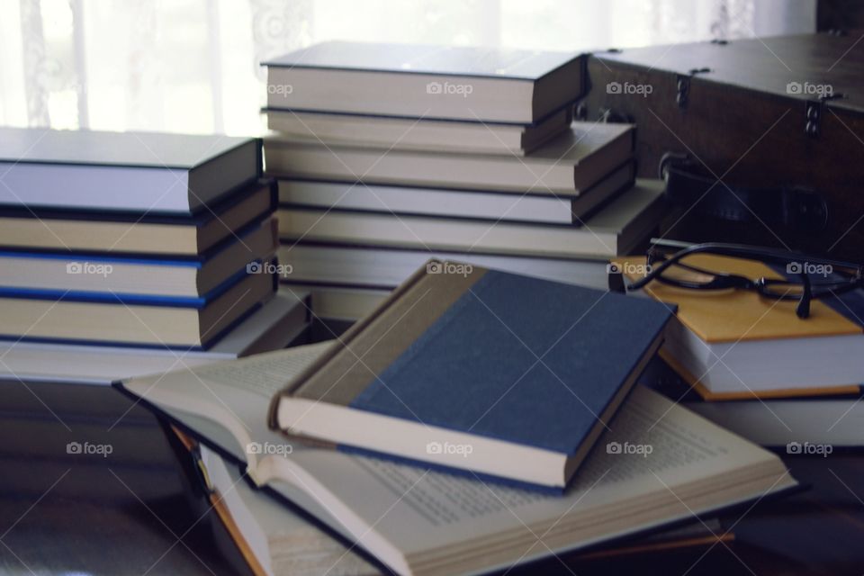 Stacks of books with plain covers 