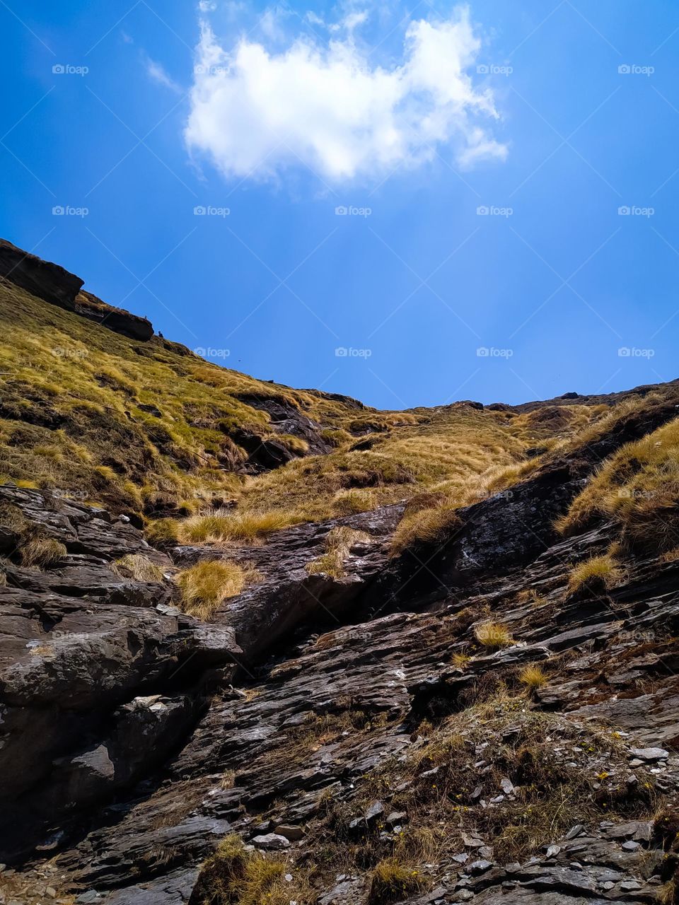 A amazing view of rock in the mountains with sky and cloud