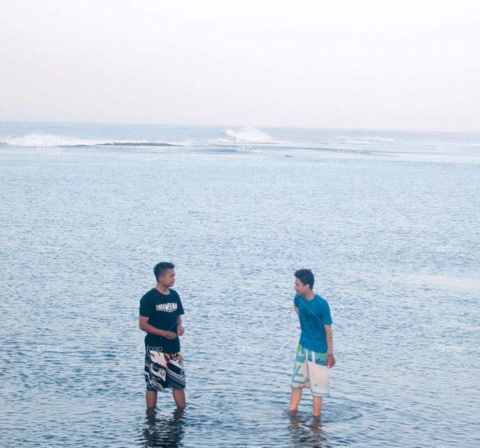 making conversation with beach background