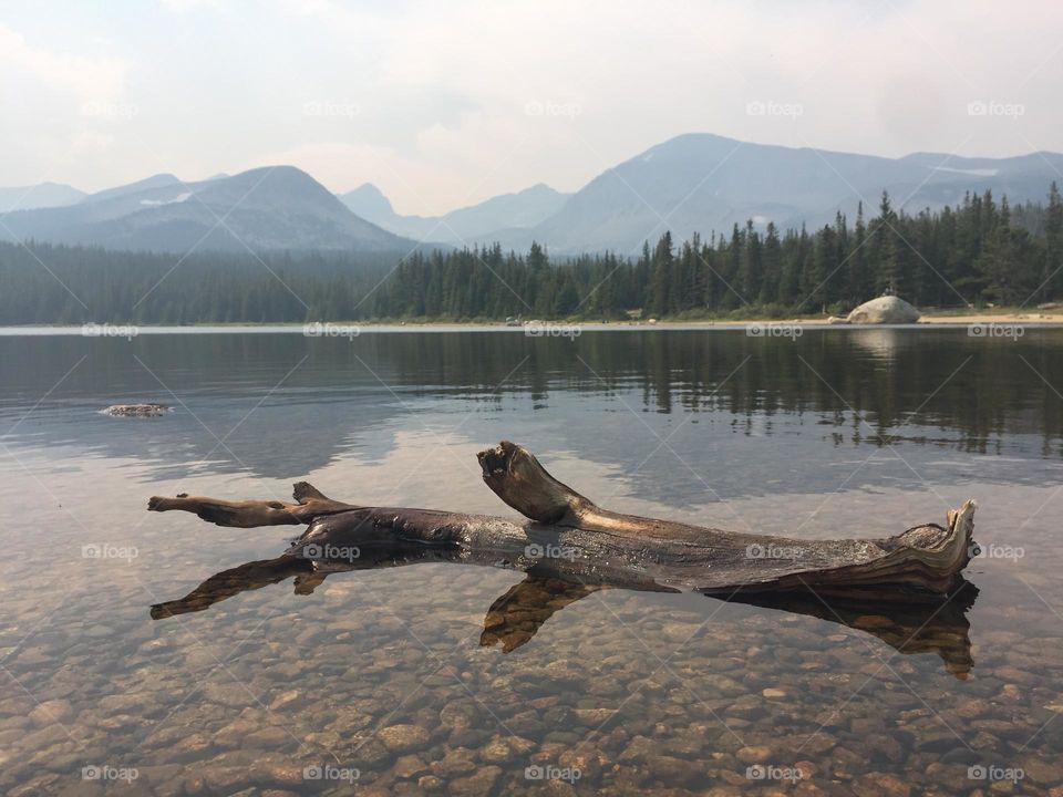 Smokey mountains over an alpine lake