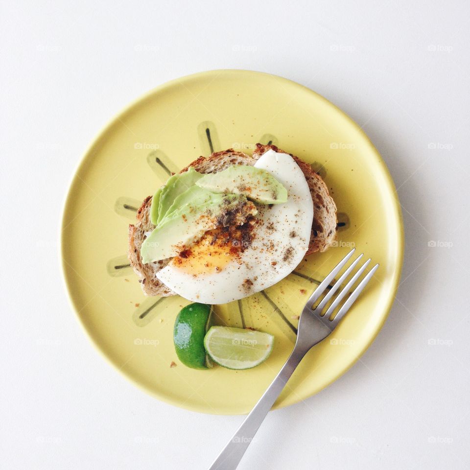 Avocado with fried egg.