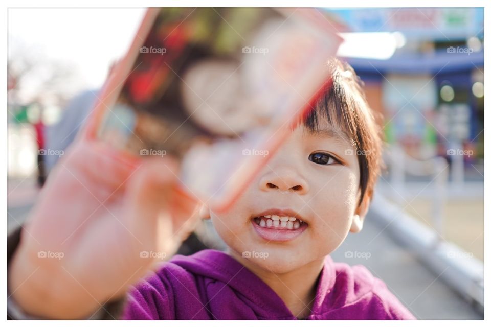 Japanese child showing train ticket 
