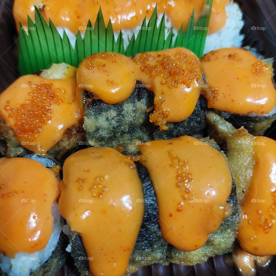 assorted sushi served in a container