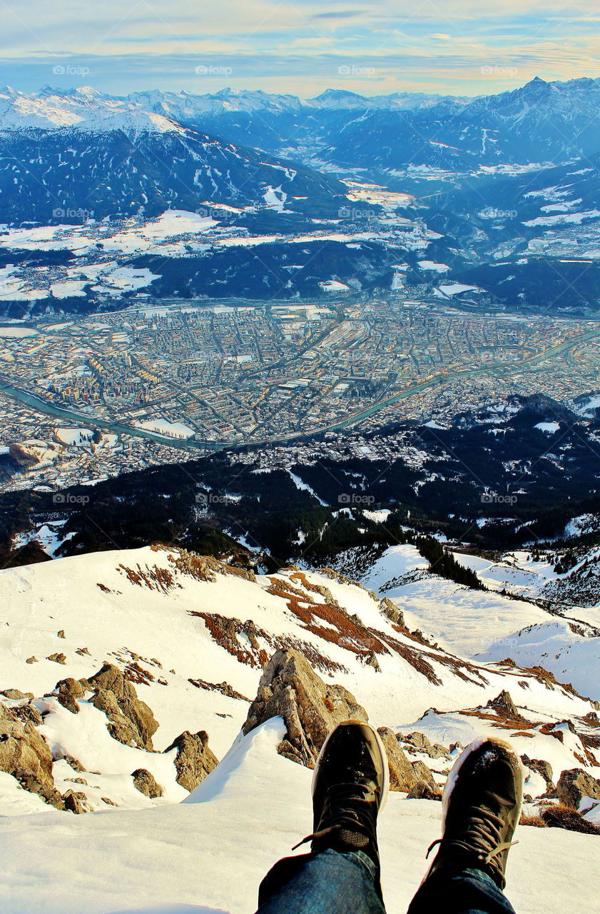 on top of one of the Austria alps seeing Innsbruck