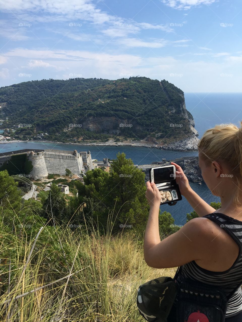 Portovenere, Italy. My wife taking a picture of the spectacular view!