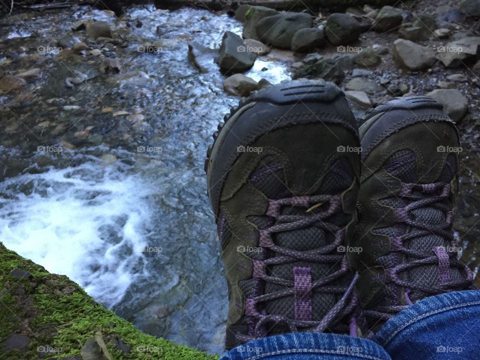 Hiking boots along a stream