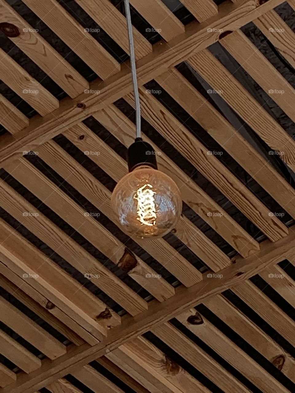 Wooden ceiling with a lamp