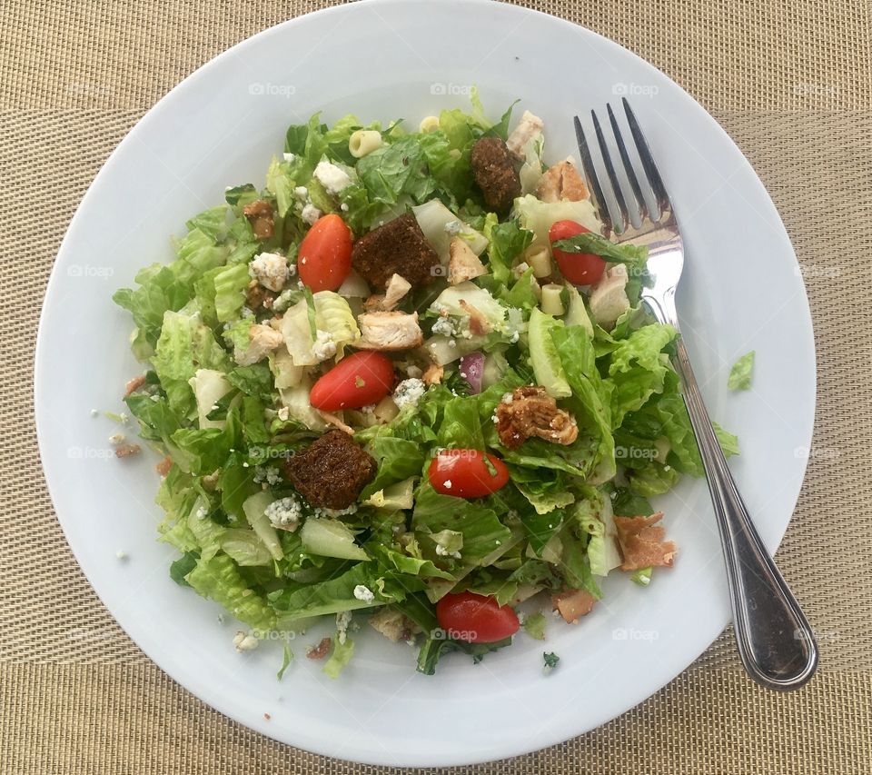 Healthy salad with chicken Gorgonzola cheese and tomatoes 