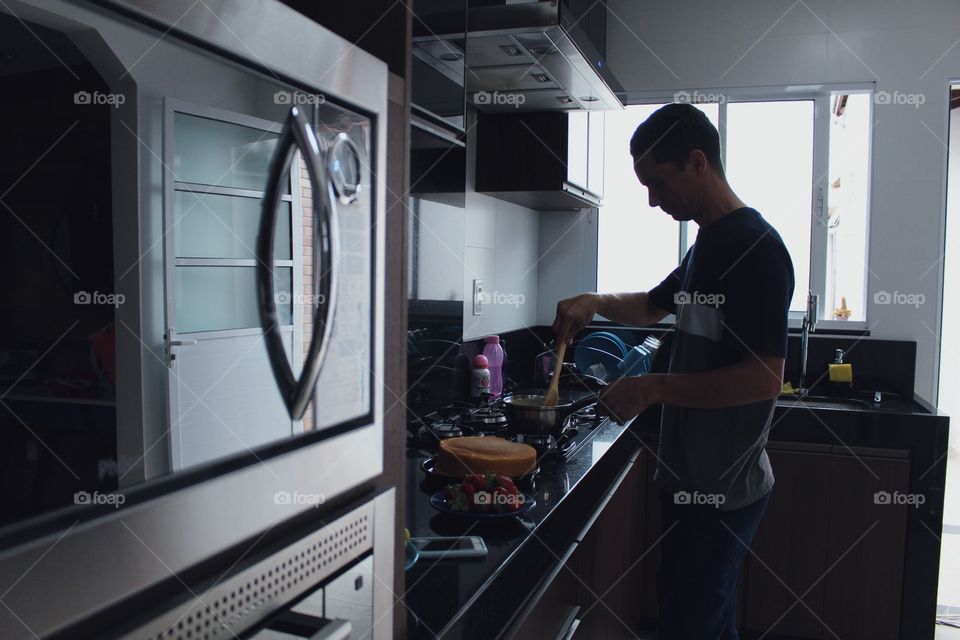 My favorite place in the house is my kitchen watching my husband cook