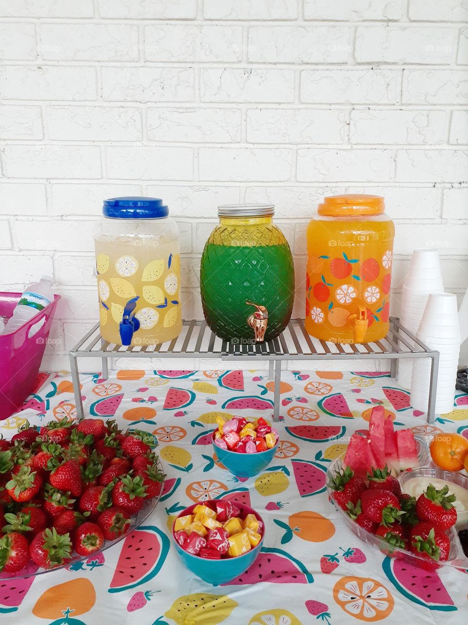 Near where I live there was a fruit festival. On one table there were trays of assorted fruit. Their were fruit drinks. And a bowl with sunburst candies in it.