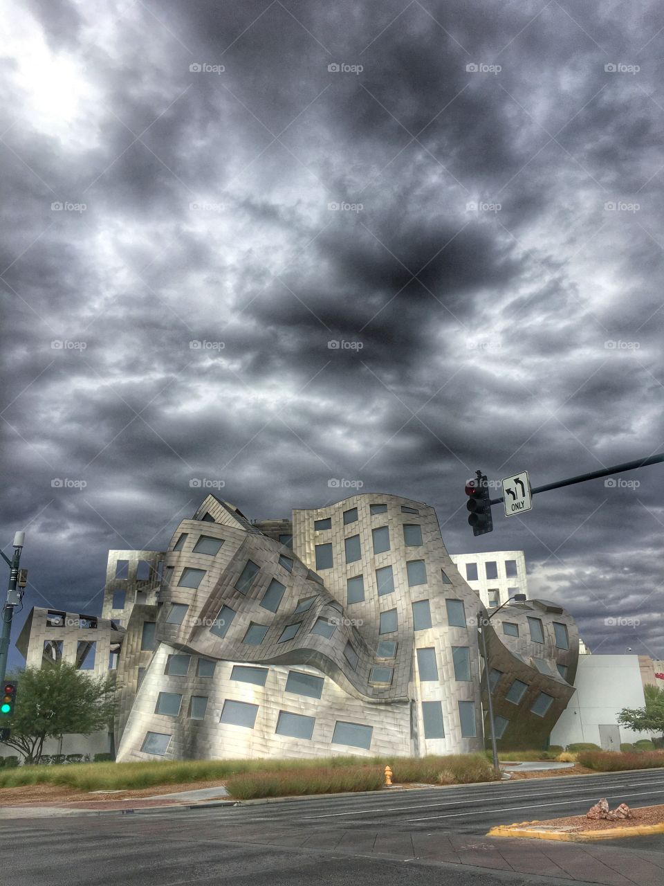 It's a grey day outside but all is not lost since we are standing in front of this really fun building. We could do a lot of fun stuff like guessing what could hide behind this contorted looking place. 