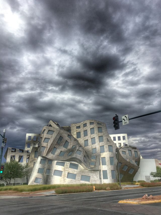 It's a grey day outside but all is not lost since we are standing in front of this really fun building. We could do a lot of fun stuff like guessing what could hide behind this contorted looking place. 