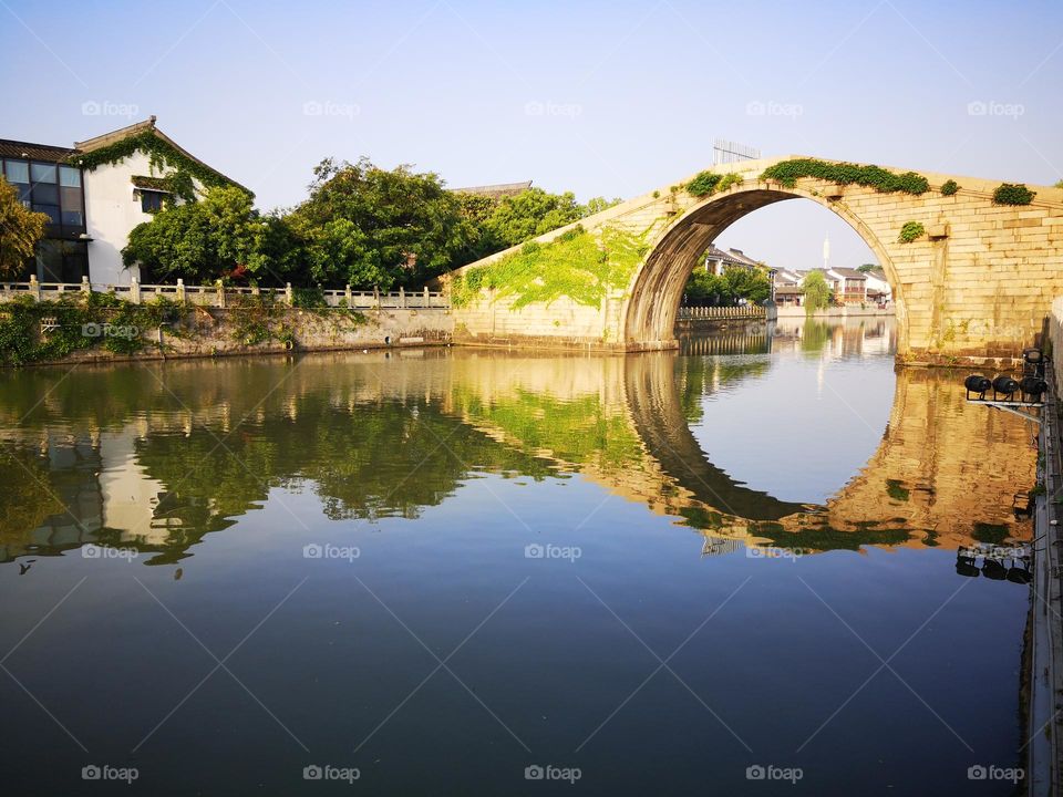 Wumen bridge over the Grand Canal in the ancient city of Suzhou (Soochow), China. The city known as Venice of the east was built in 514 BC. It is characterized by its multitude of canals and classical gardens.