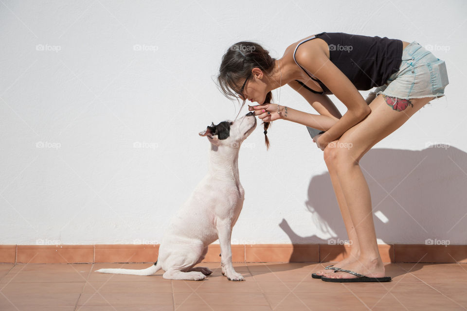 Girl talking to his dog