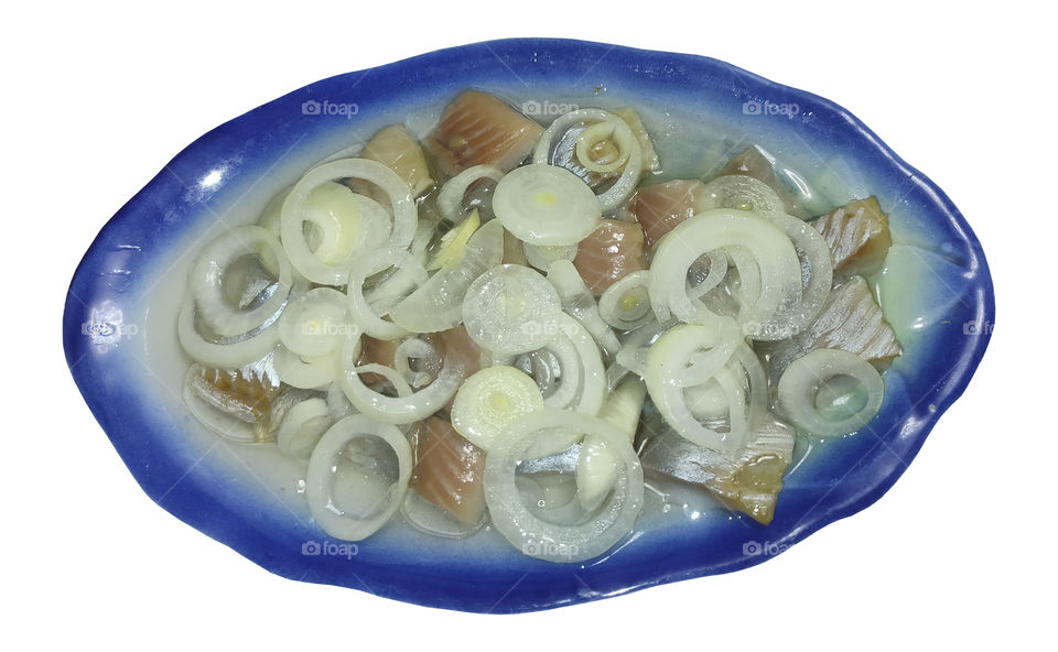 loghtly salted herring with piclled onions and vegetable oil