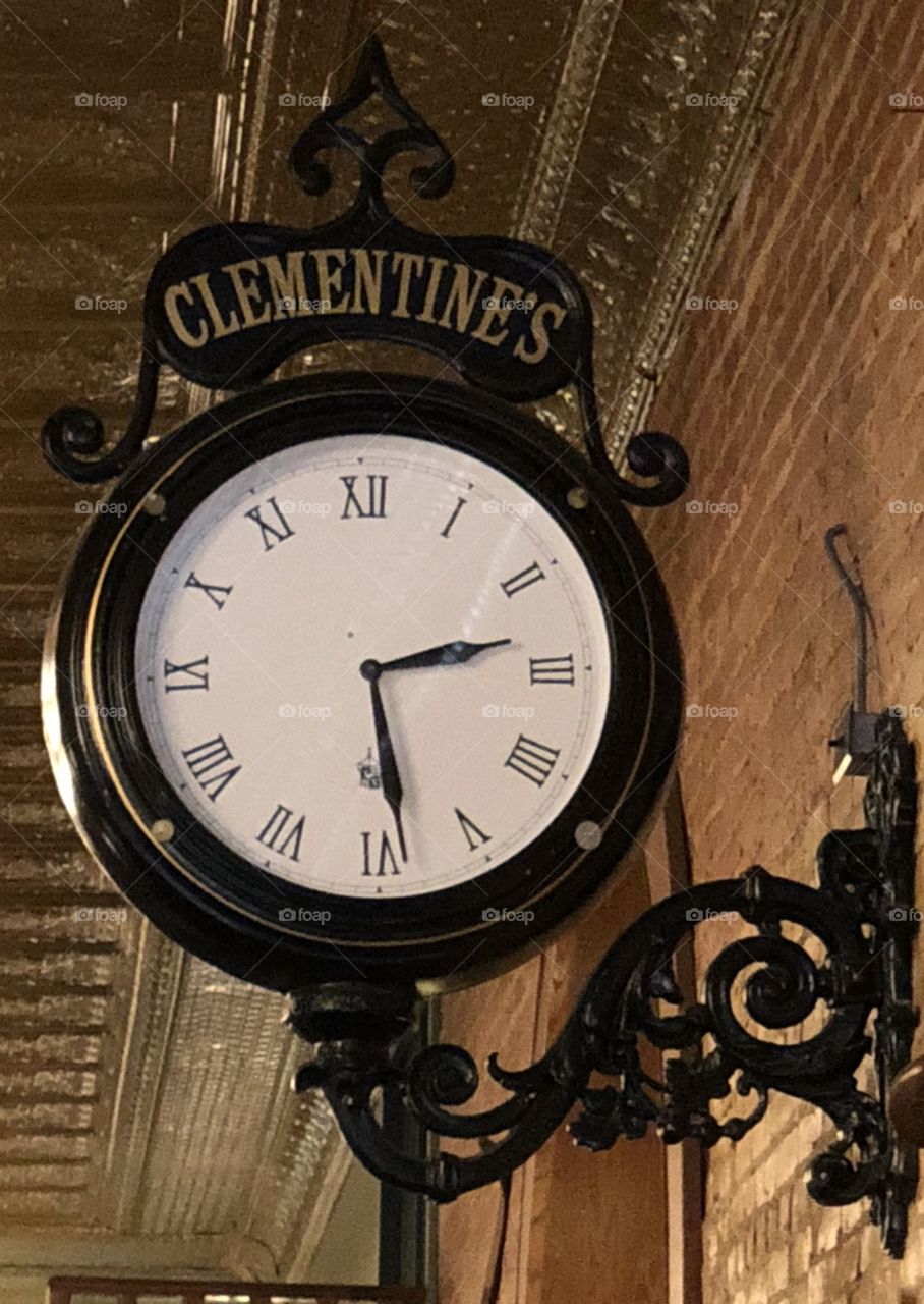 Circular Clock on the Wall At Clementine’s Restaurant in South Haven, Michigan, USA