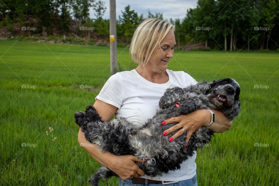 Love and CARE, the dog and the OWNER.
THE dog loves to lay in the arms to the mom