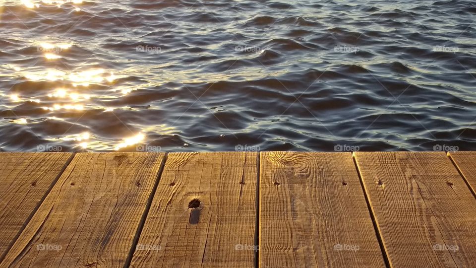 High angle view of wooden pier on water