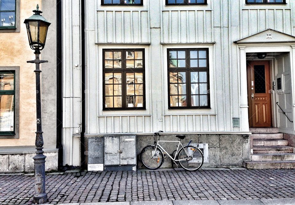 Bicycle against apartment wall