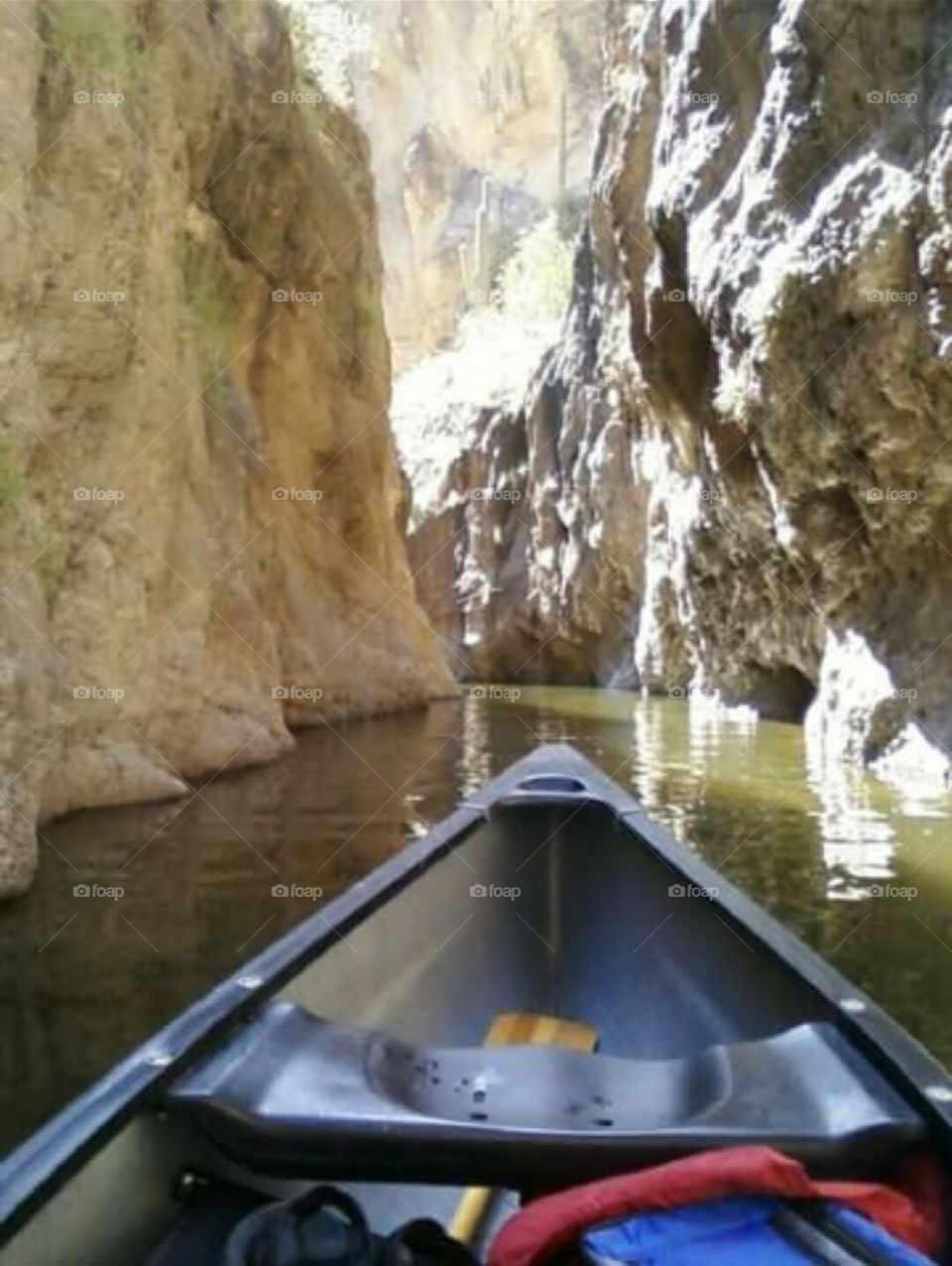 Canoeing a narrow tributary on Canyon Lake, Arizona.
