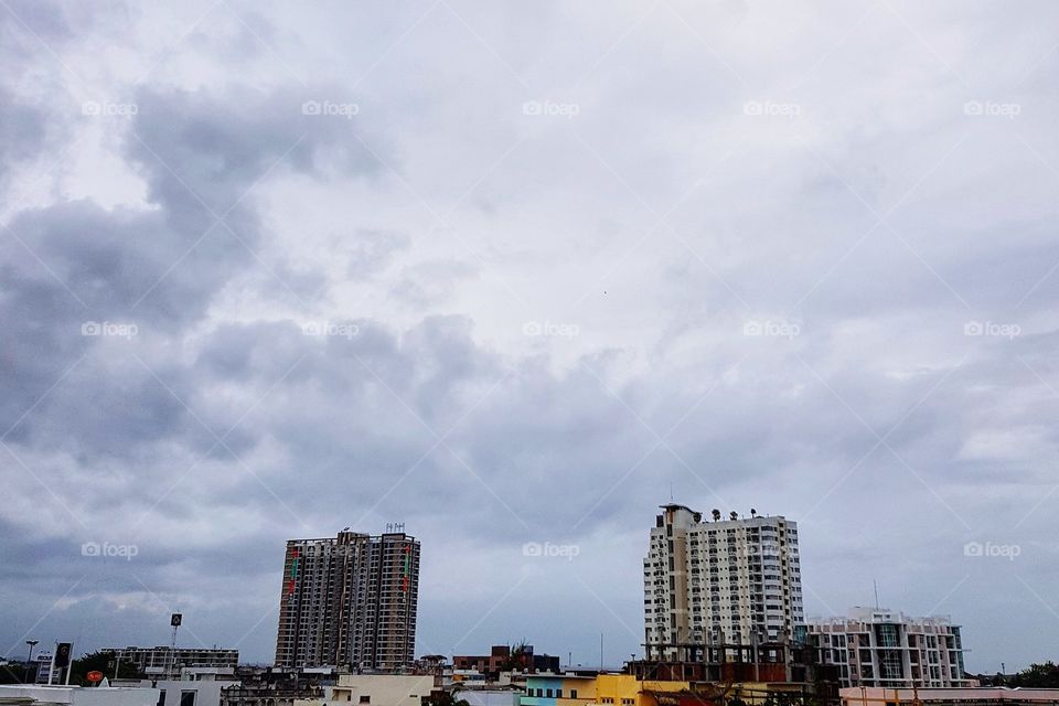Storm clouds over skyscraper at city