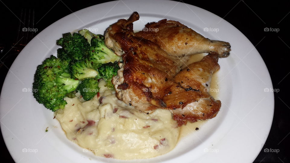 Chicken  Dish. chicken with broccoli  and mashed potatoes