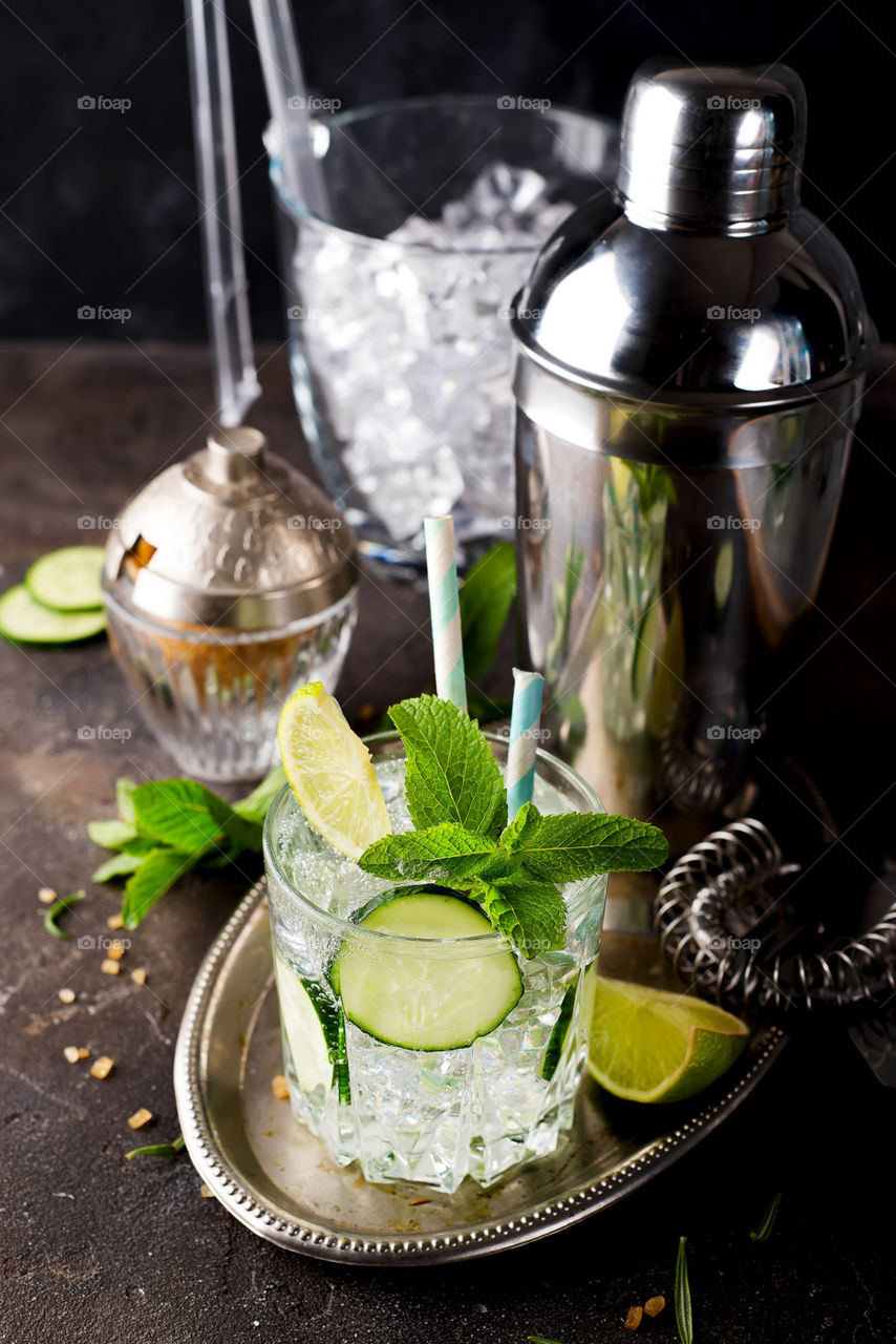 cold summer cocktail with ice and slice citrus