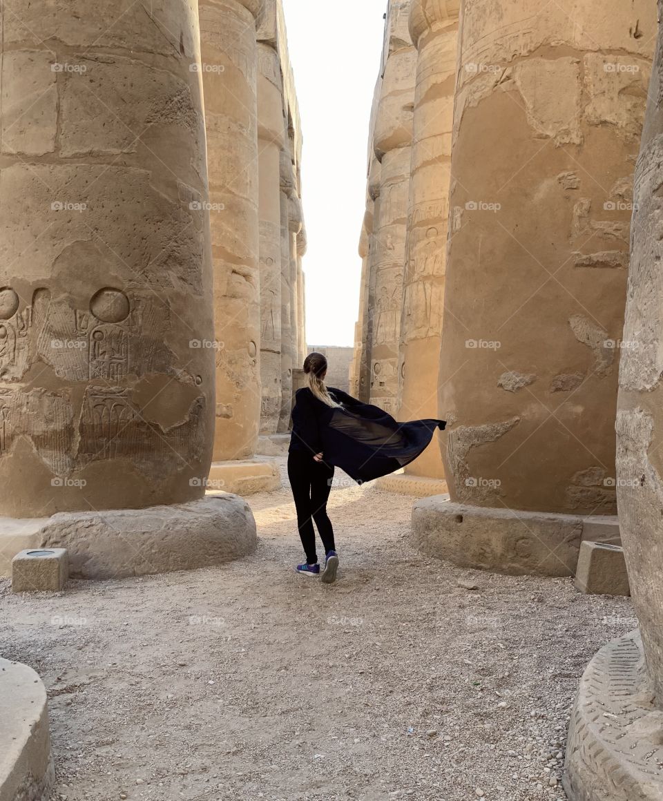 Scenic Luxor temple and mysterious girl in black 