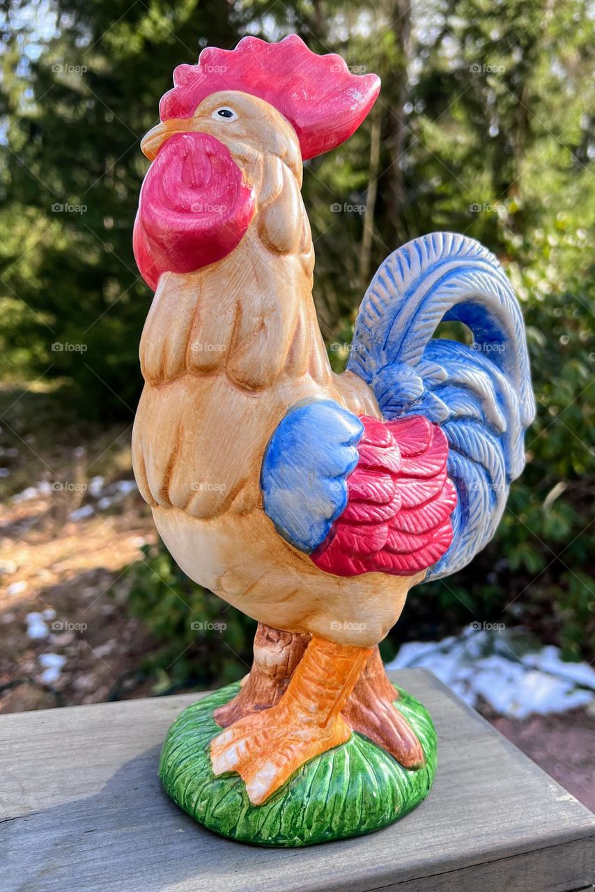 Close up of the ceramic bright traditional Easter rooster cockerel 