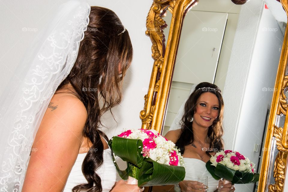 Beautiful bride in the mirror
