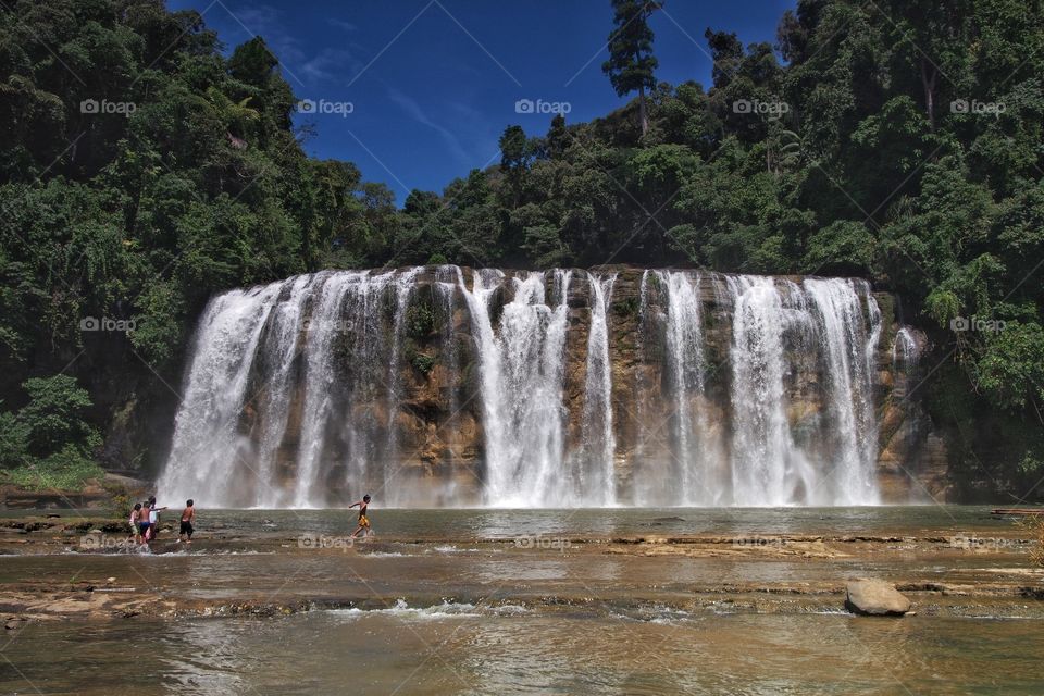 Playing in front of Tinuy-an falls