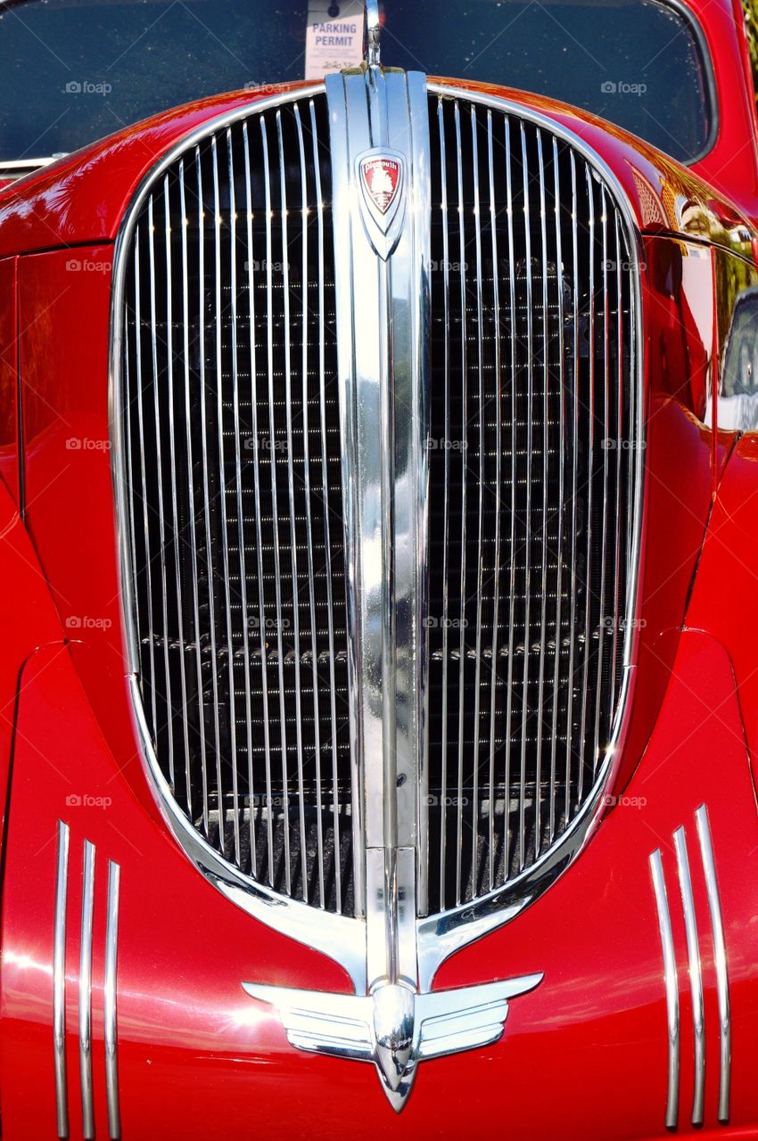 Front end grill on a classic Plymouth car.