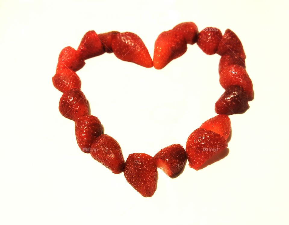Delicious Red strawberries in the shape of a heart.