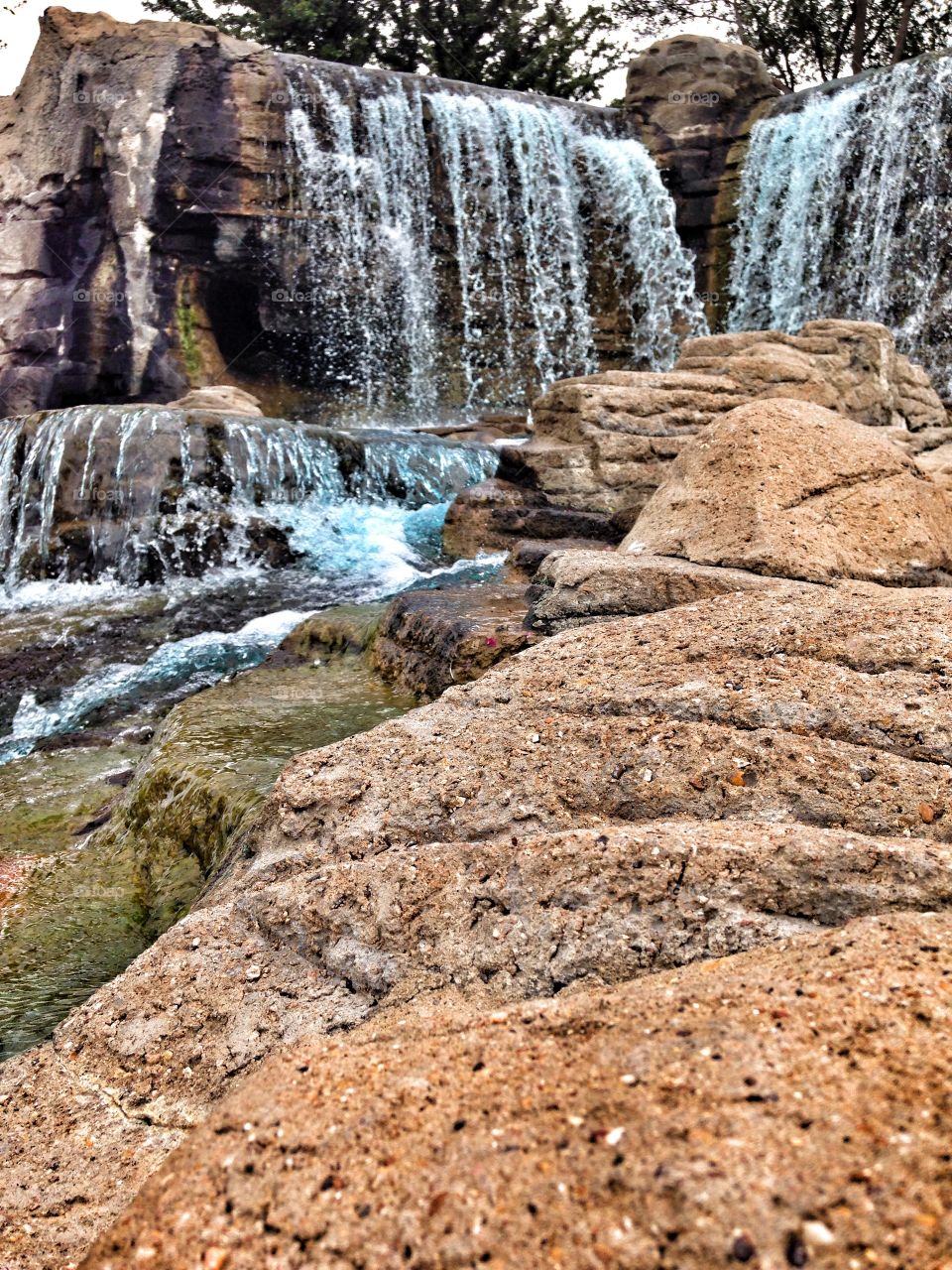 Summer view. Waterfall at mini golf course